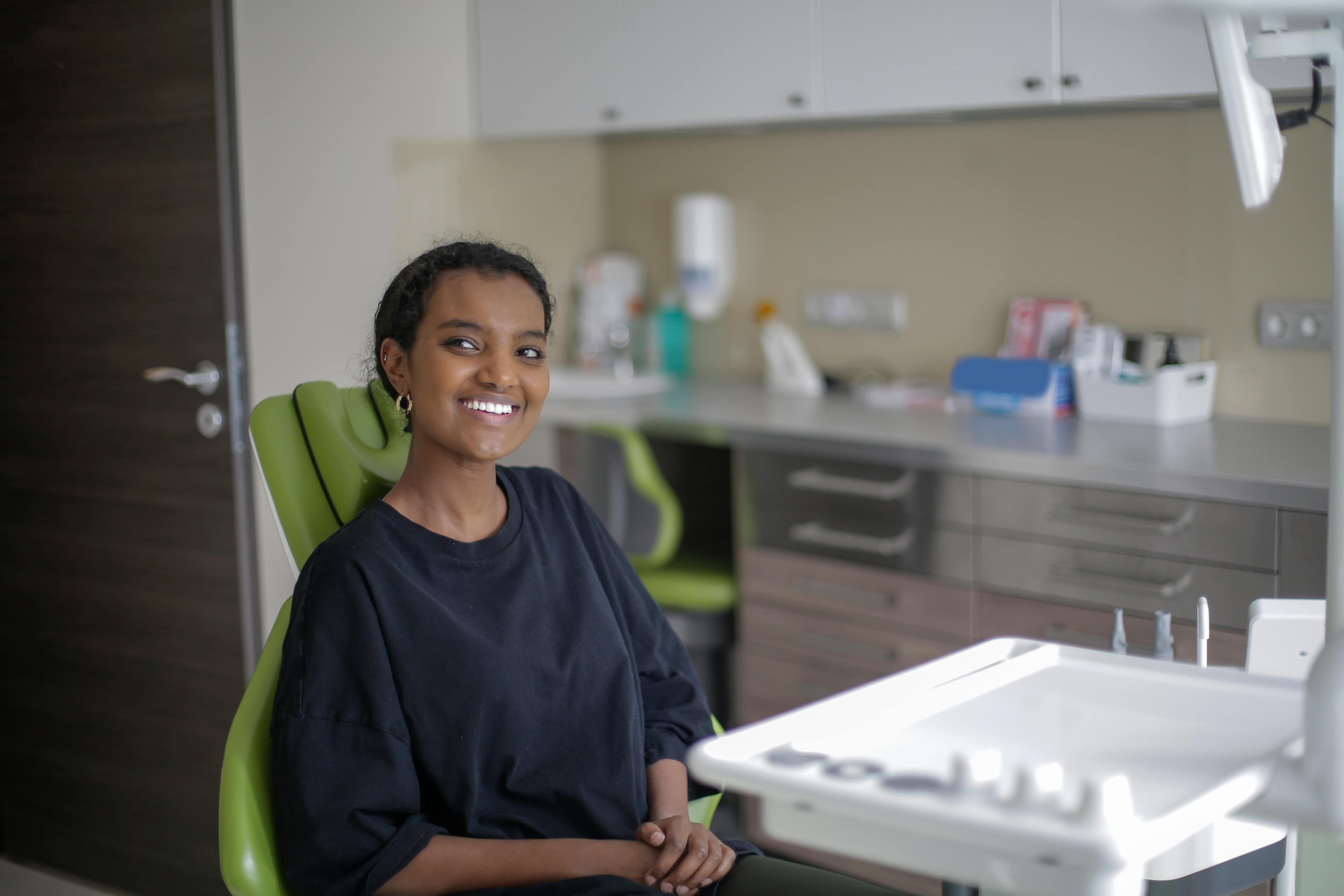Young African woman smiling in a dental clinic
